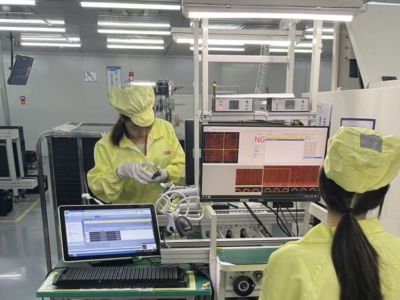 Quality control technicians performing final inspection -Greenspcba Technology